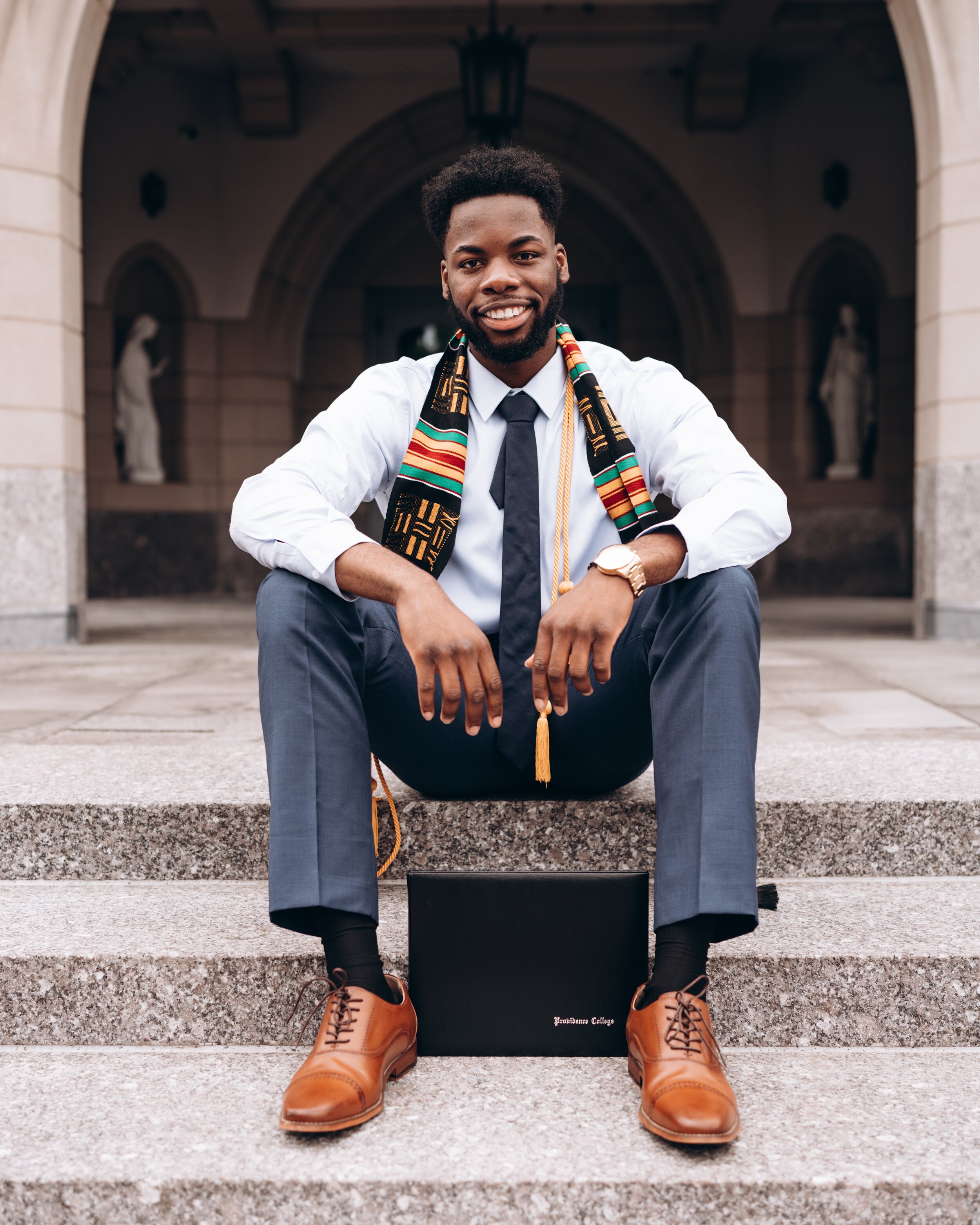 Graduated student sitting on steps